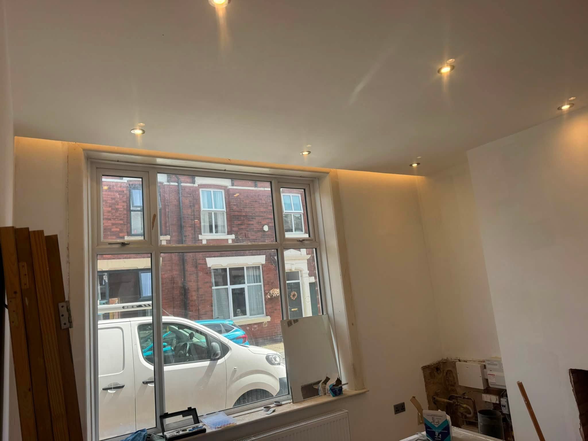 Room with lighting around the ceiling perimeter