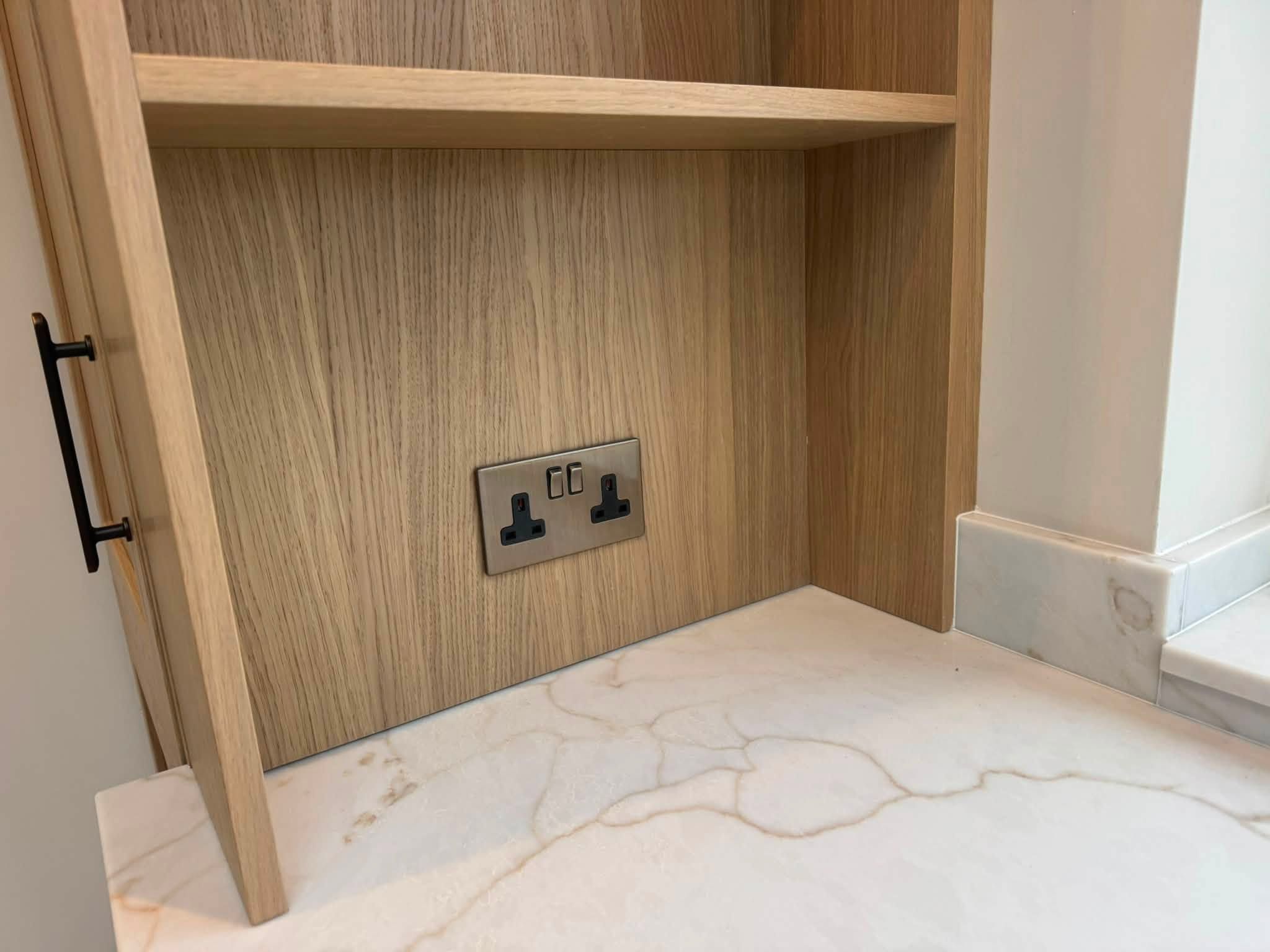 Double socket set into a timber kitchen niche