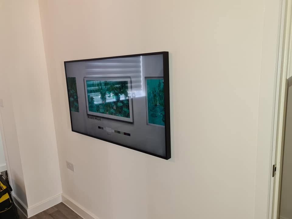 Wall-mounted control panel with a display