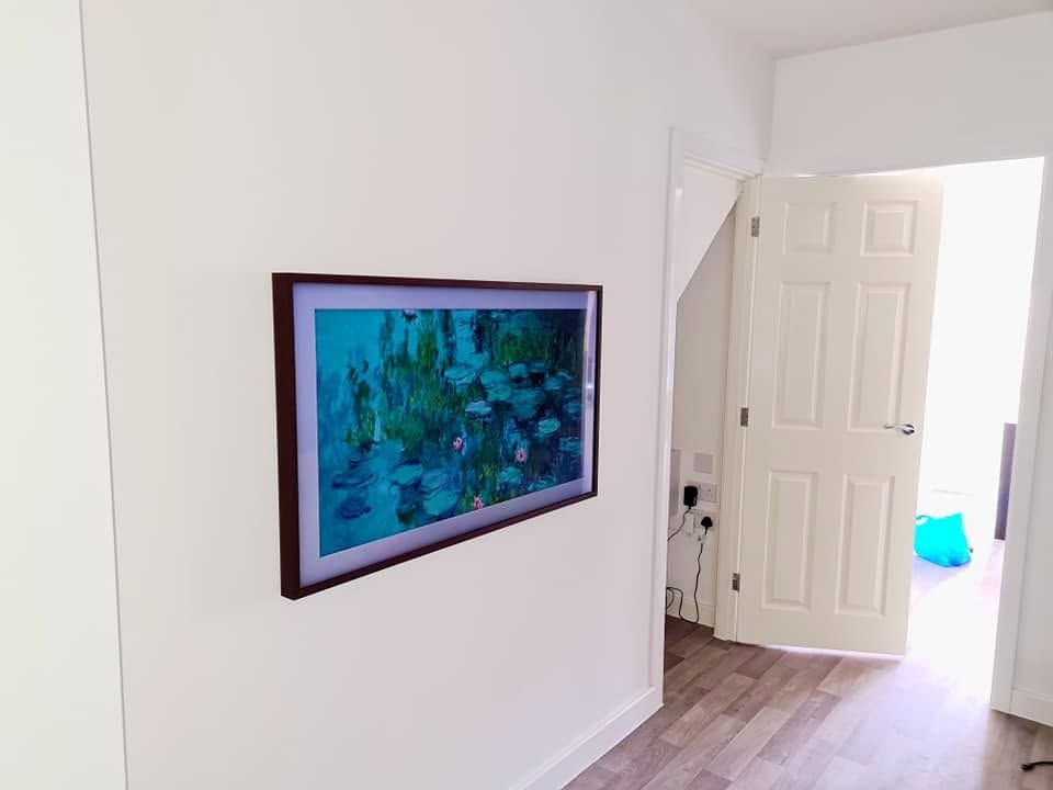 Wall-mounted screen displaying artwork